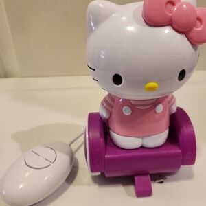 Hello kitty Pink electric scooter toy with hand held battery operated remote